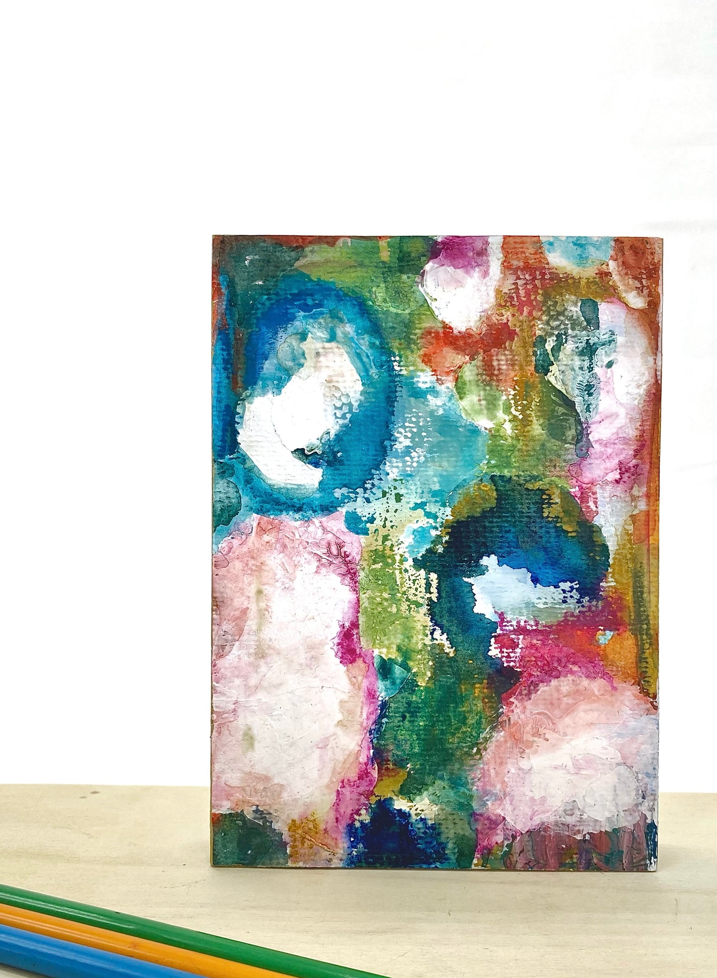 Abstract painting with colorful circles on a white background